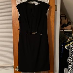 Calvin Klein black sheath dress.  Stylish gold accents.  Gold zip up back.  6